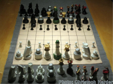 The starting-up position in Shogi with westernized pieces in 3D.
